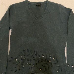 Green sweater with cutouts
